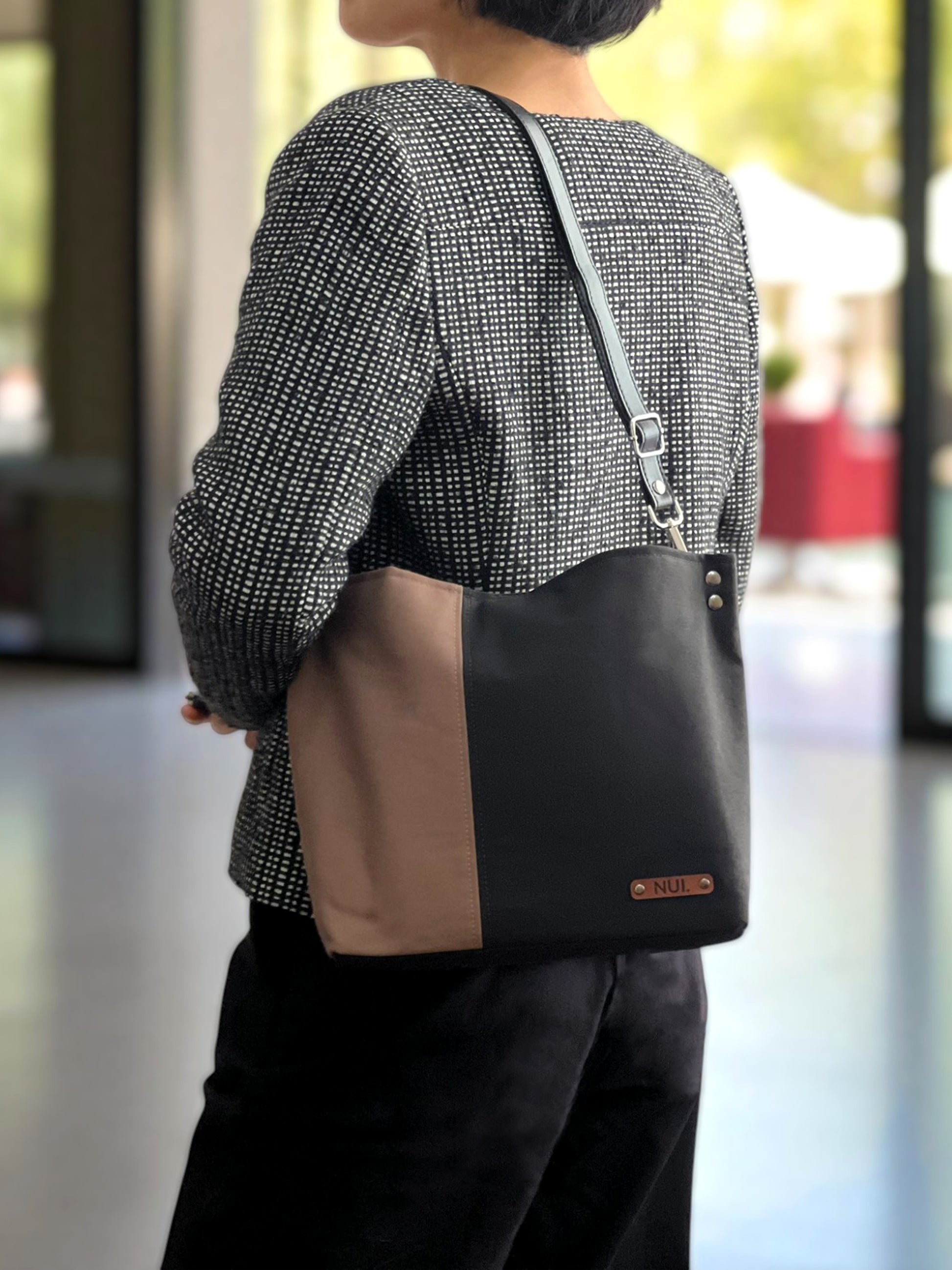 NUIdesign Black and Wild Mushroom tote bag worn on the shoulder, slow-crafted in Melbourne.