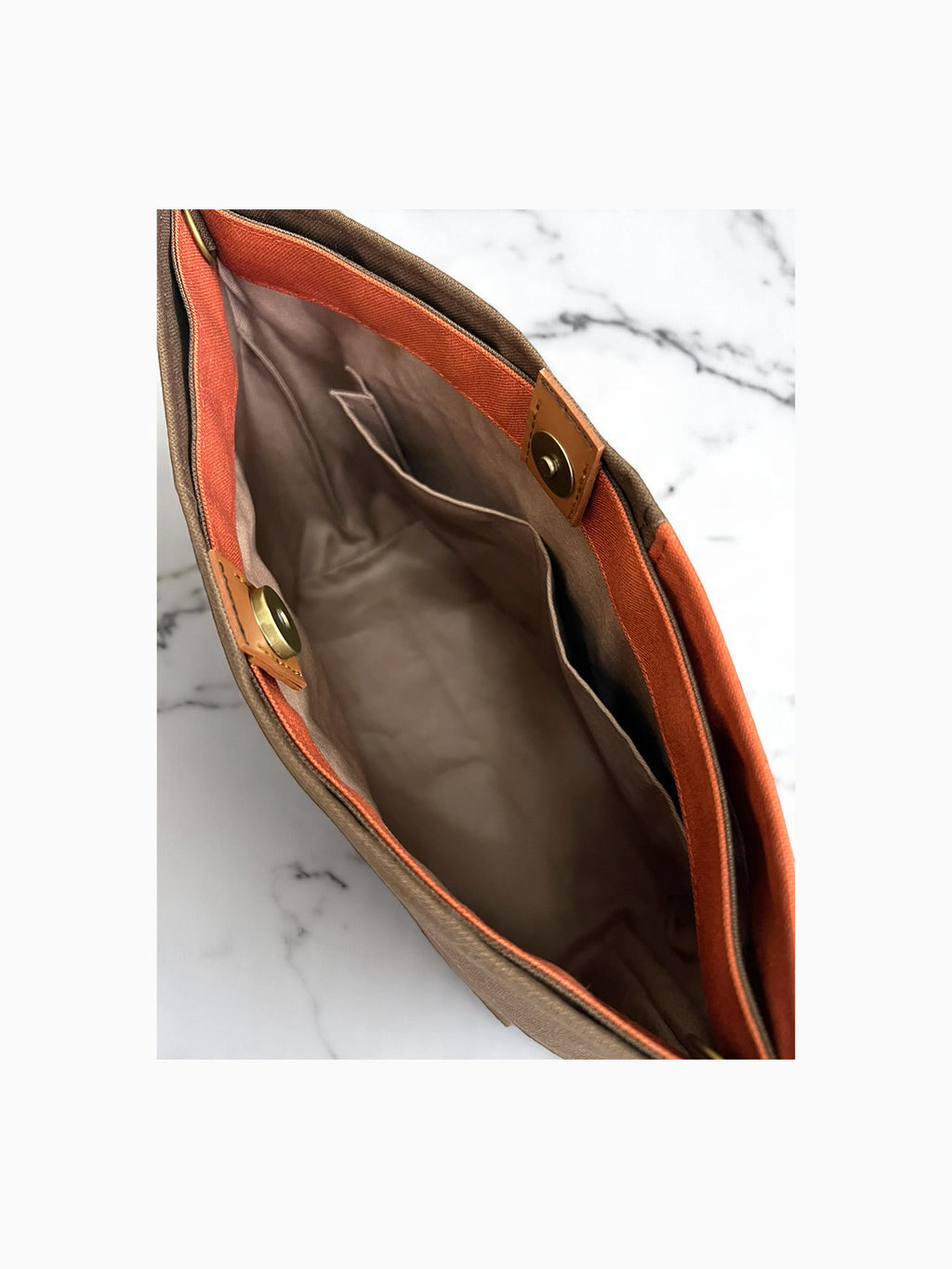Inside view of the NUIdesign Brown and Terracotta tote bag with cotton lining, pocket detail, and magnetic snap, slow-crafted in Melbourne.
