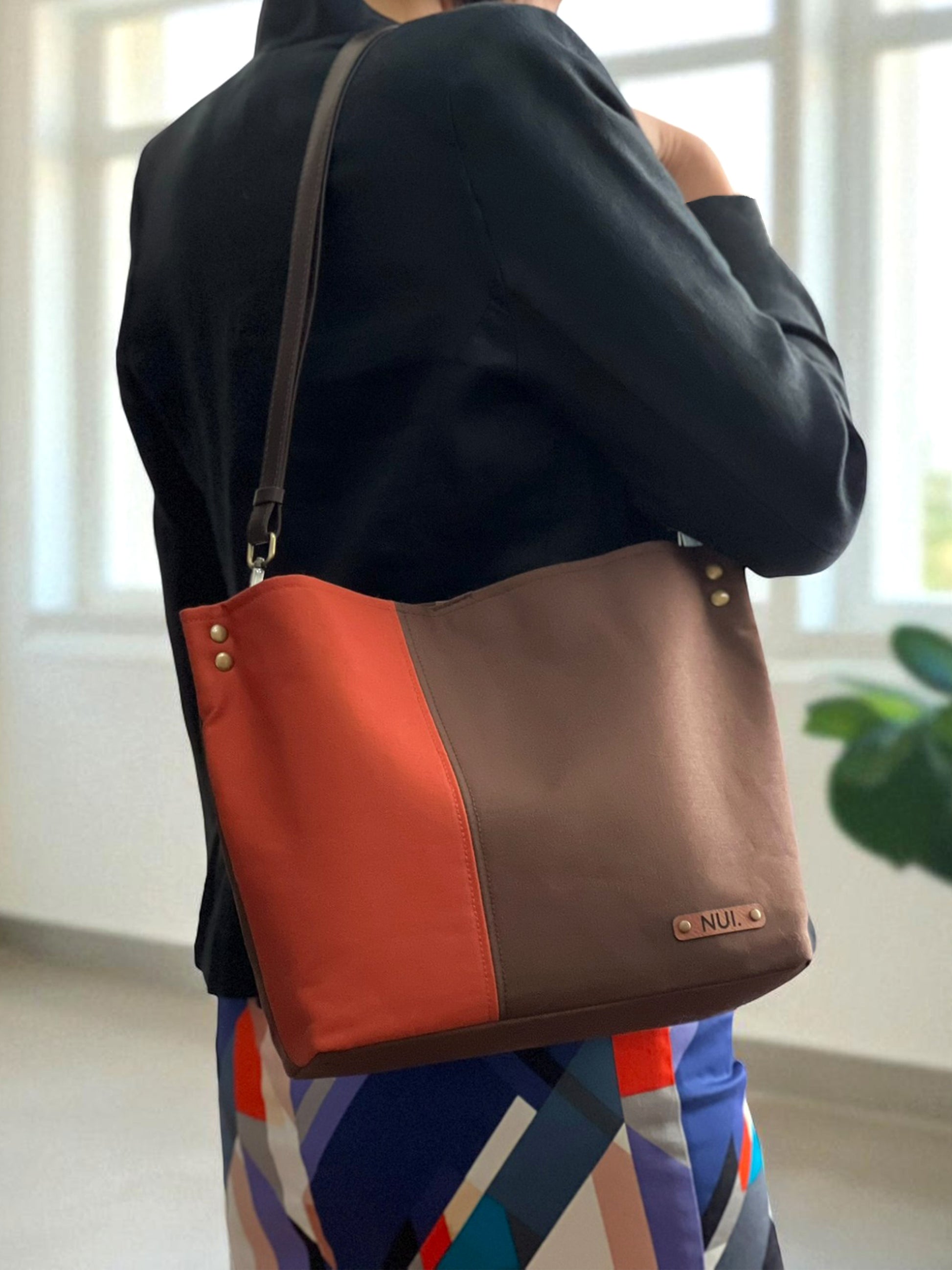 NUIdesign Brown and Terracotta tote bag worn on the shoulder, small-batch handmade design