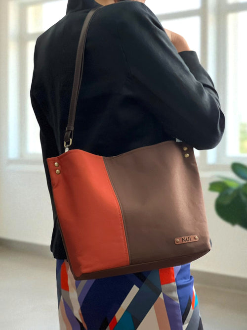 NUIdesign Brown and Terracotta tote bag worn on the shoulder, small-batch handmade design